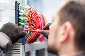 man installing cables