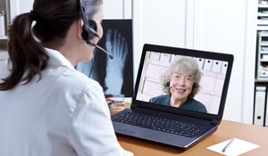 female-doctor-chatting-with-patient-over-web-conference