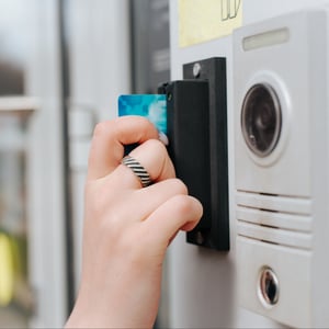 woman-opening-door-using-card-entry-access-system-2025-03-16-20-03-59-utc